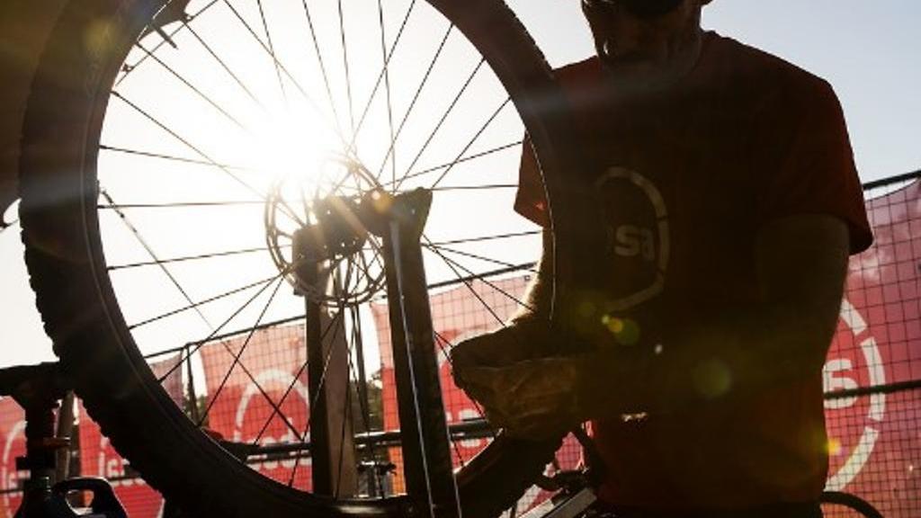 Person doing bike maintenance and service