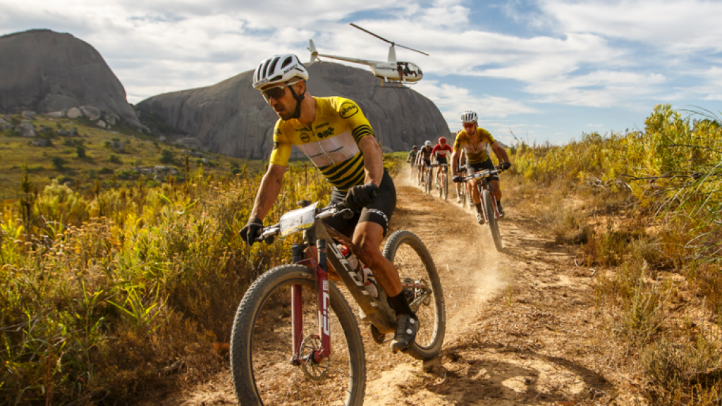 Riders at the Cape Epic with a helicopter over them