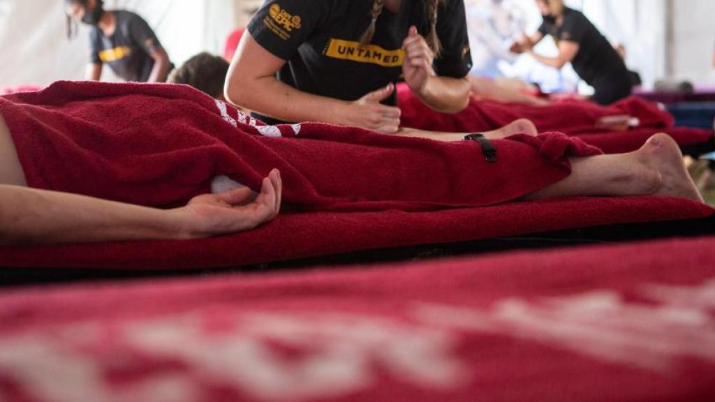 Person giving massage to a rider