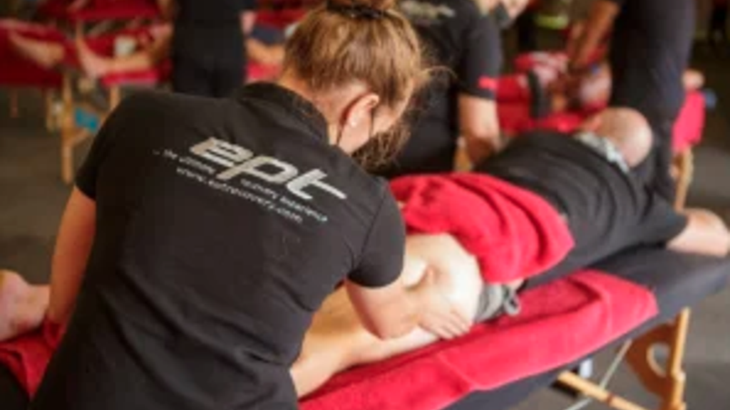 Person giving a rider a massage