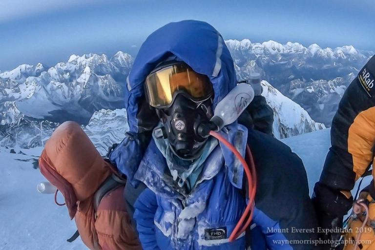A close up of Morris wearing his oxygen mask in high altitudes
