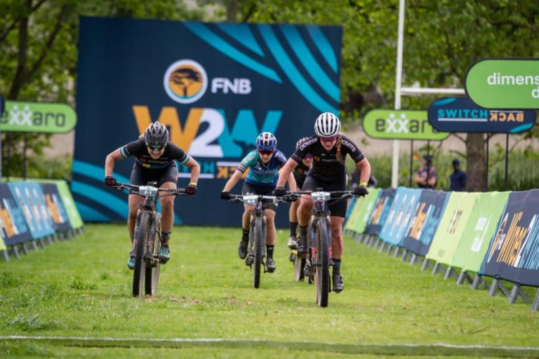 Two bikers picking up dust in the W2W race