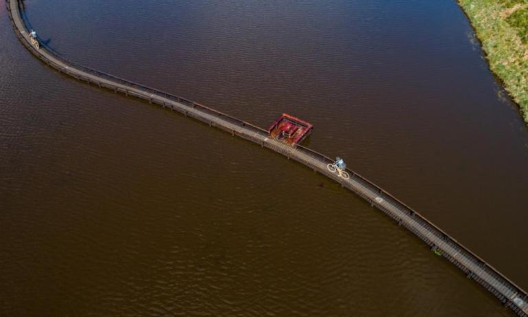 An overhead shot of the narrow biker bridge