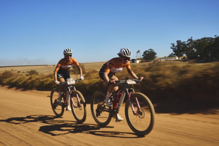 Annika Langvad and Sofia Gomez Villafance followed by a helicopter