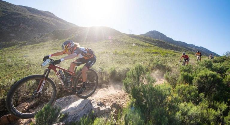 Bikers cycling across the hills of Absa Cape