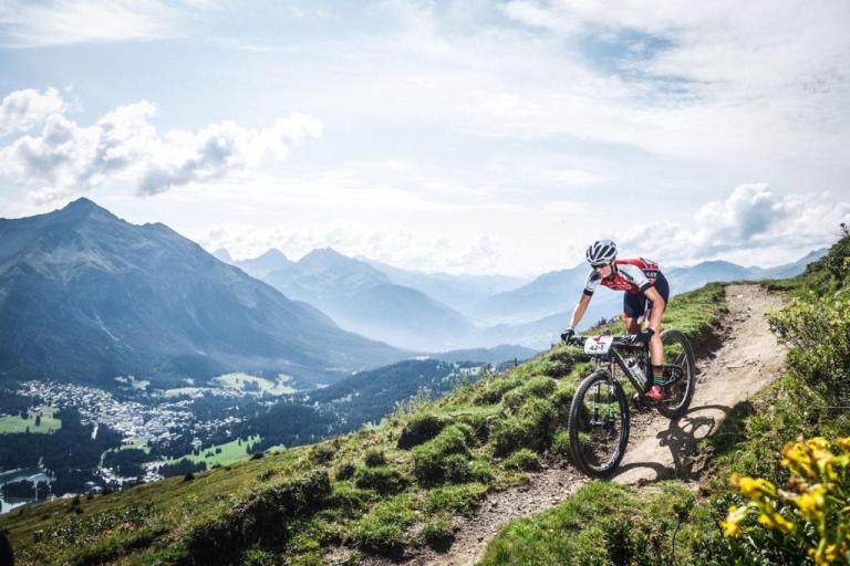Dohrn racing with the beautiful foggy alps in the background 