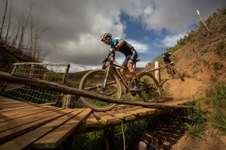 Two bikers on a dusty trail