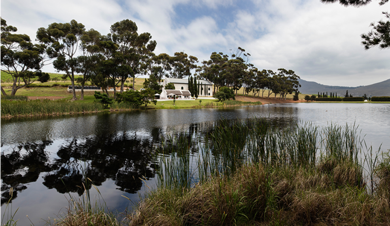 Shot of a farm across the river