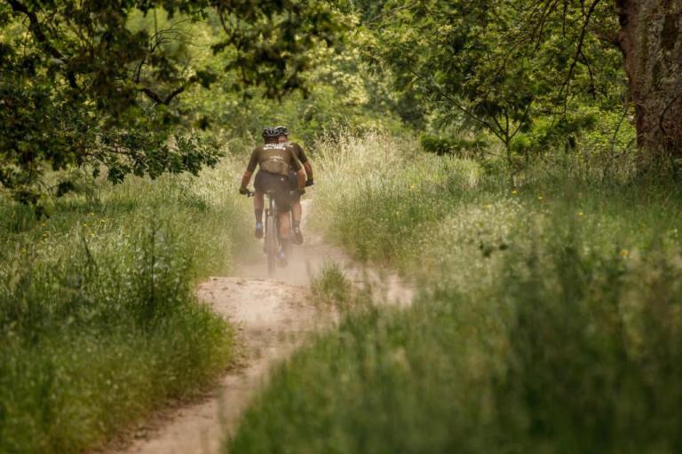 Imbuko Giant leading the bikers through a prairie 