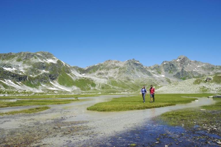 Two bikers hiking around the mountains of Davos