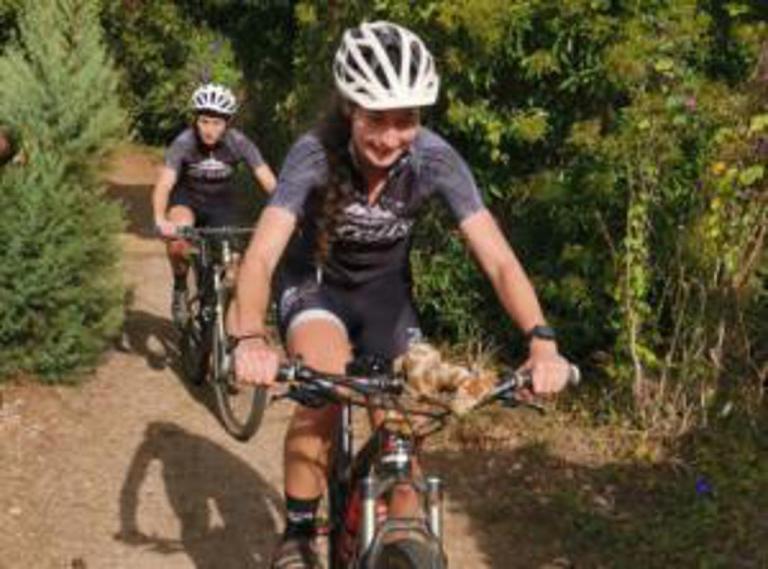 Bianca and Cally on the charge during the bike leg of their at home 70.3