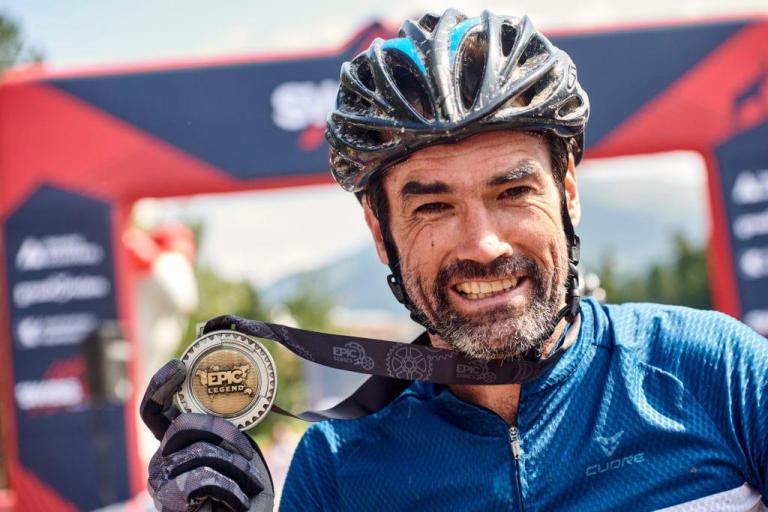 close up of marius holler holding his medal