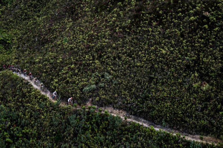 Overhead shot of a narrow path and multiple bikers
