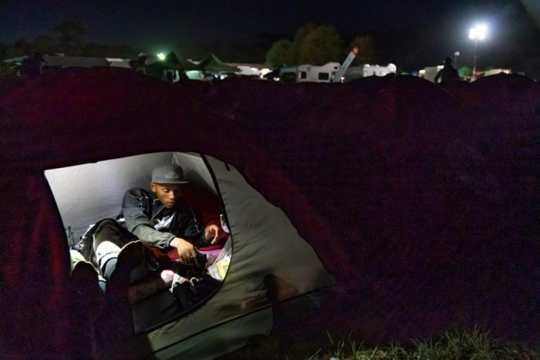 a biker resting in a tent