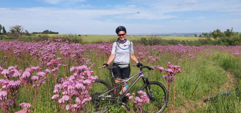 Rowena Kemp in  a field of flowers