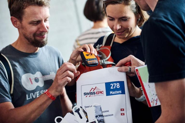 Items for the Swiss Epic, a number and tracker for the bike