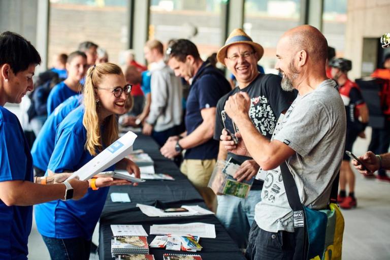 Bikers laughing at the registration table