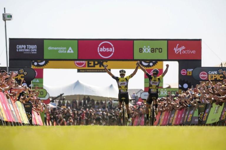 Two bikers crossing the Swiss Epic finish line
