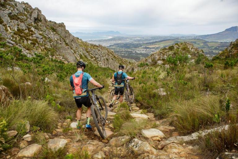 Riders portage down Gantouw Pass 
