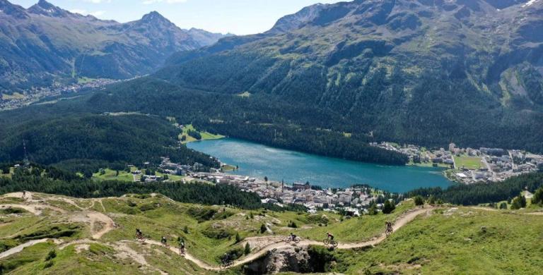 Sky shot of the swiss landscape with bikers on a pass