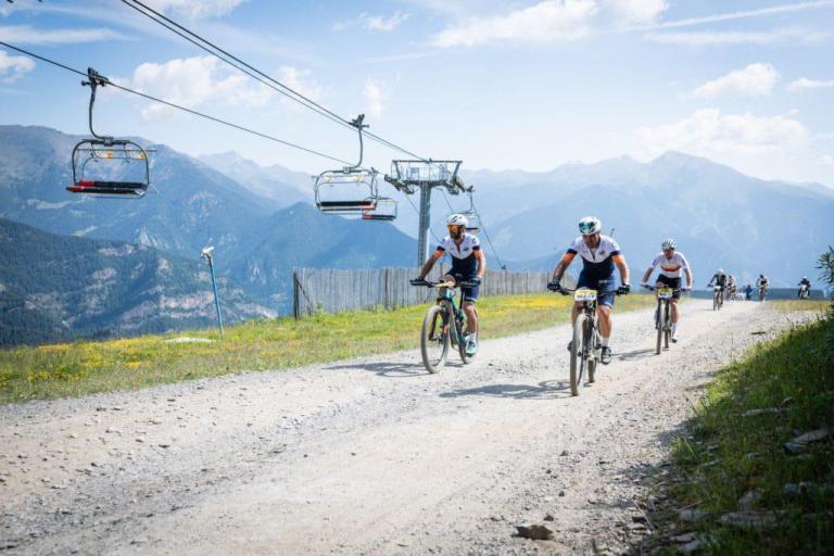 Bikers heading by a ski lift 