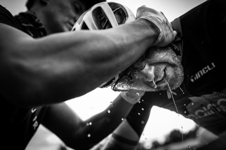 Black and white image of biker sweating profusely