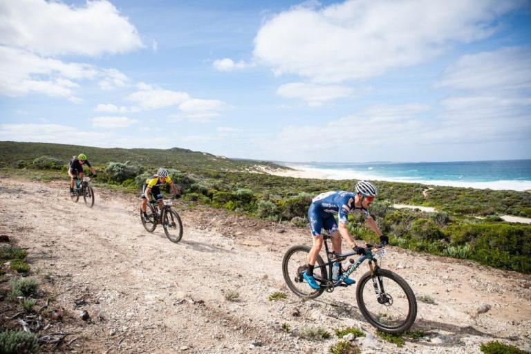 3 bikers against the oceanline