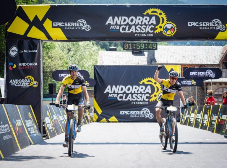Two bikers crossing the Andorra Classic at 1:59:49