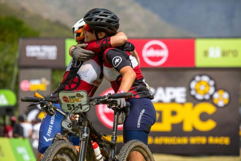 Frei and Stigger embracing