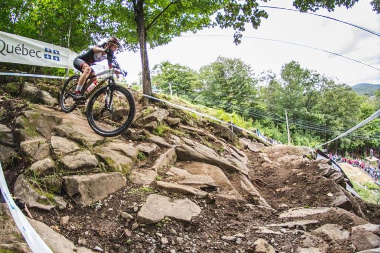 Haley Smith biking down rocks