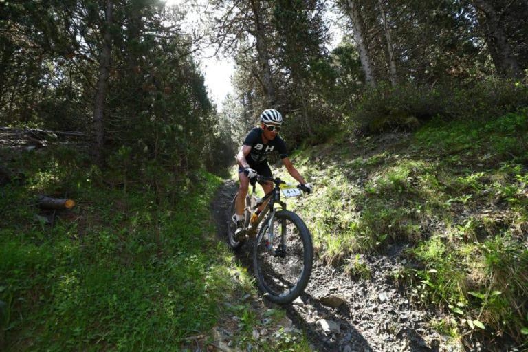 One biker heading through a small Andora trail