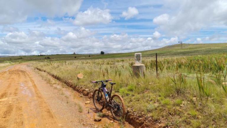 One bike on a dusty road