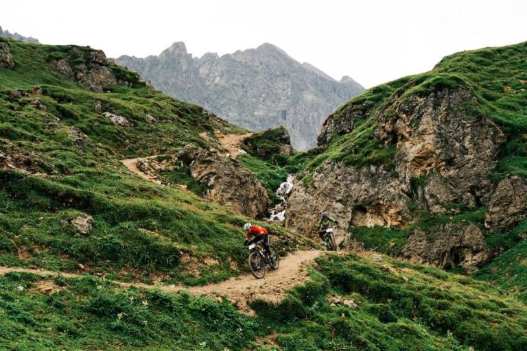 The San Marco team heading down a narrow mountain path