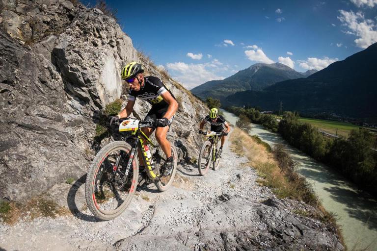 Two bikers heading up a mountain on the Swiss Epic