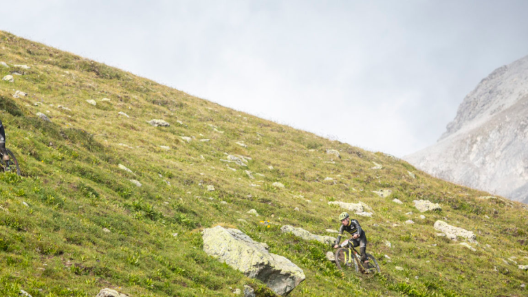 A large,steep hill with bikers traversing the side of it [Epic Series]