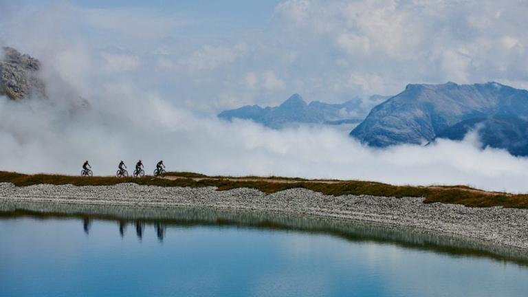 Four bikers on a foggy swiss epic ride [Swiss Epic]