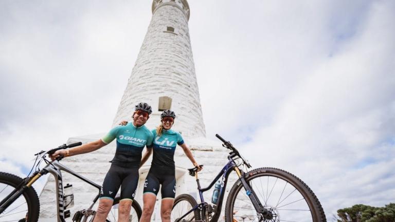 Two bikers posing in front of Cape Leeuwin lighthouse [Cape to Cape]