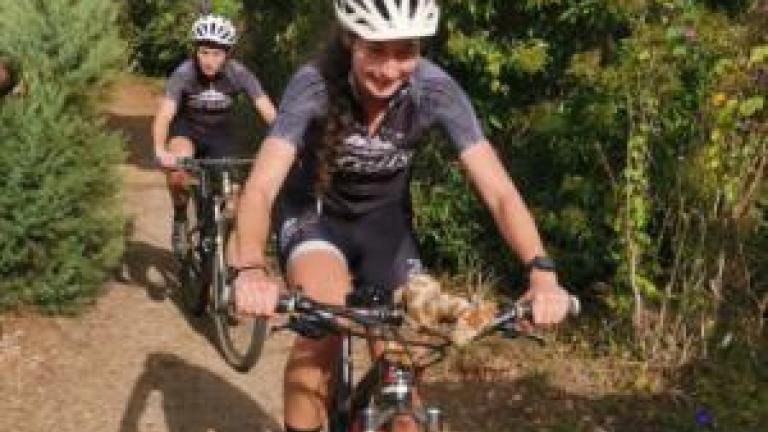 Bianca and Cally on the charge during the bike leg of their at home 70.3 [FNB Wines2Whales]