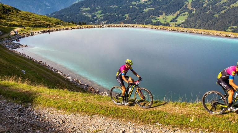The Pyrenees race with a beautiful lake in the background [Andorra MTB Classic-Pyrenees]