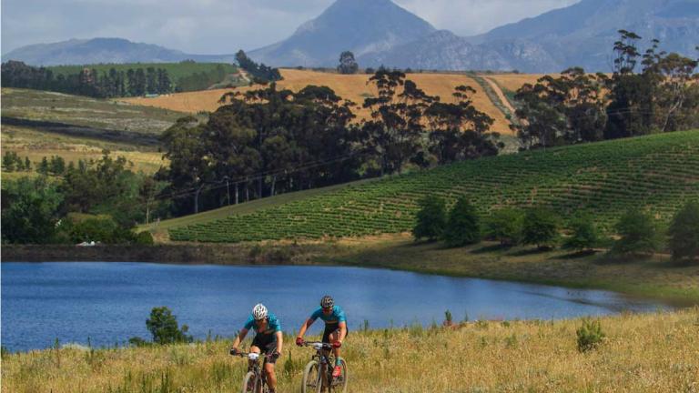 Two bikers on e-bikes [FNB Wines2Whales]
