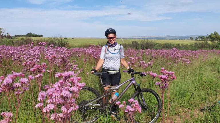 Rowena in a field of flowers [FNB Wines2Whales]