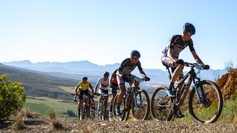 Angled shot of bikers heading up a mountain path [Epic Series]