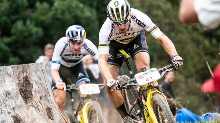 Schurter and Forster racing past a stump [Absa Cape Epic]
