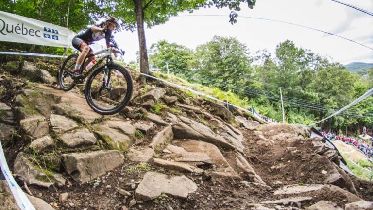 Haley Smith biking down rocks [Epic Series]
