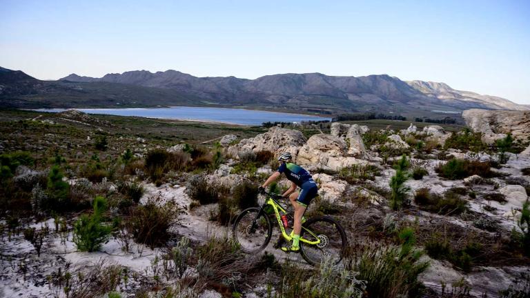 Singular biker on a rocky landscape [FNB Wines2Whales]