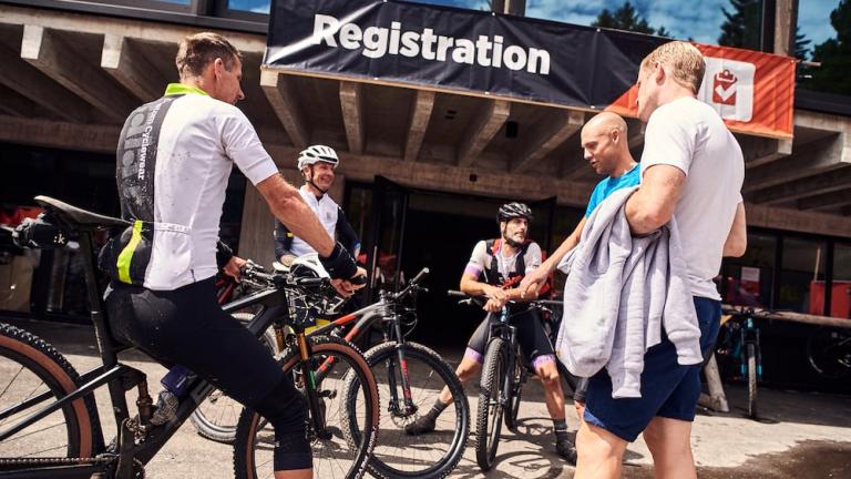 Bikers talking in a circle [Swiss Epic]