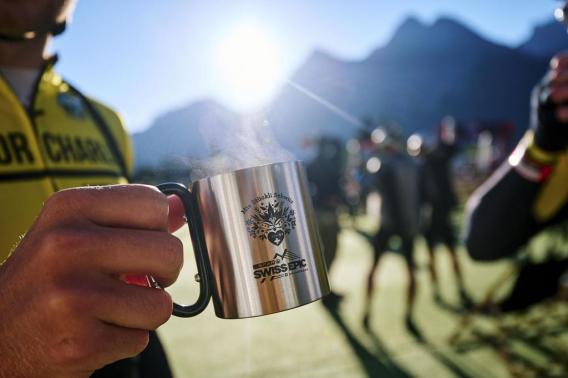 Rider with a reusable coffee mug at Swiss Epic