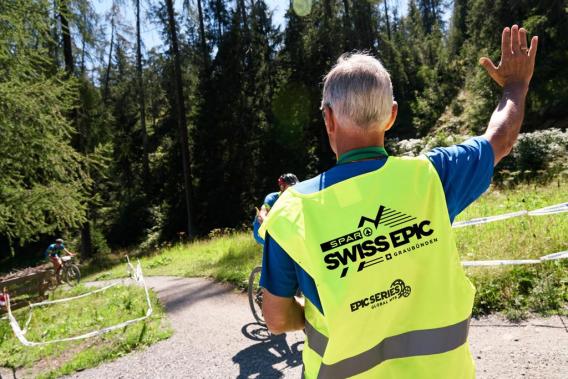 Volunteer helping at the route at Swiss Epic