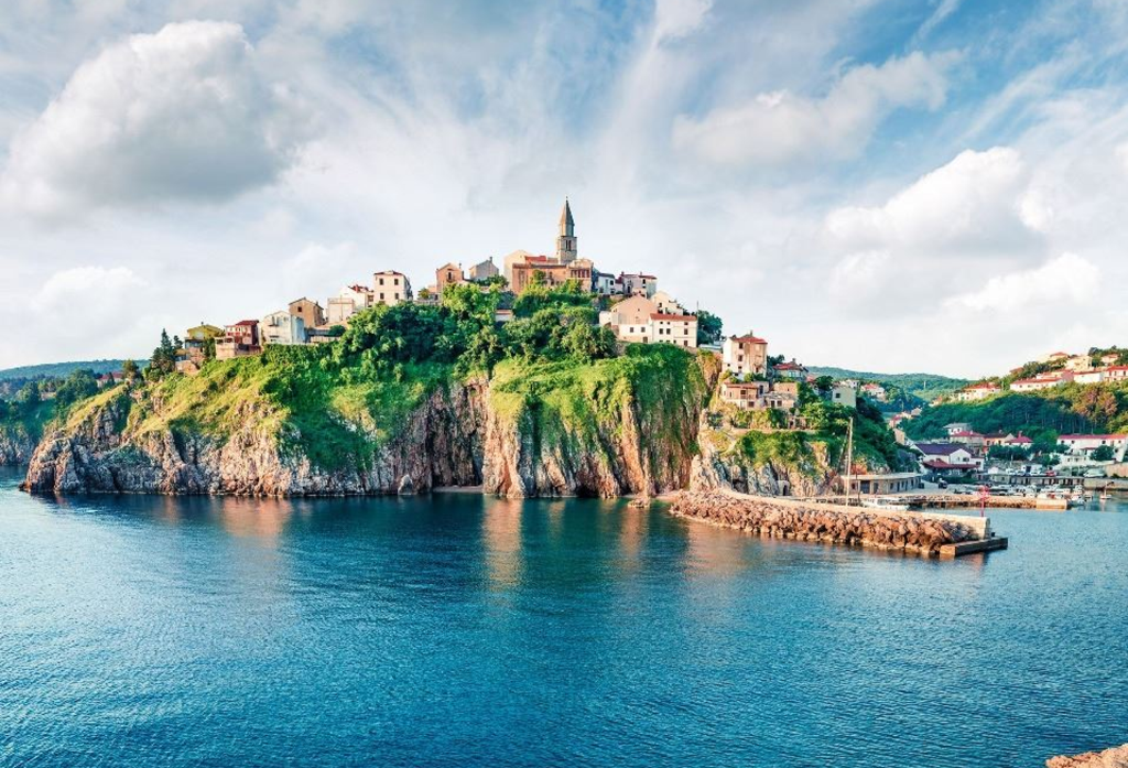 View of a city on a hill at the sea