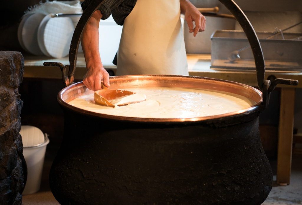 Man with cheese in a pot